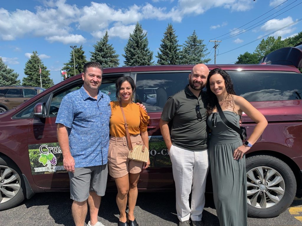two couples in front of the mini van did the Kings & Queens of the Krooked Lake with lunch, tastings and lunch at Bully Hill. They are in front of Keuka Spring winery, they also visited Dr Franks and Heron Hill. All on Keuka Lake.