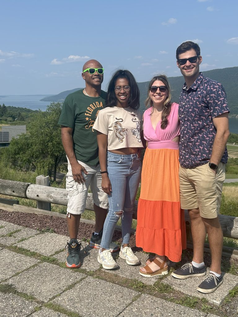 two couples photo was taken at the over look on county rd 12, in naples or bristol. They did the Sip & savor wine tour on Canandaigua lake. They visited Hazlitt Red Cat Cellars, Inspire Moore, Arbor Hill and Heron Hill (Canandaigua lake).